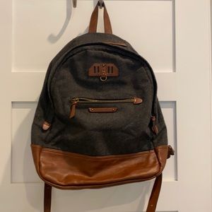 Navy and brown faux leather backpack.